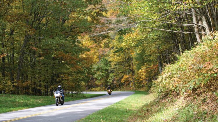 Two motorcyles wind their way down the Blue Ridge Parkway.