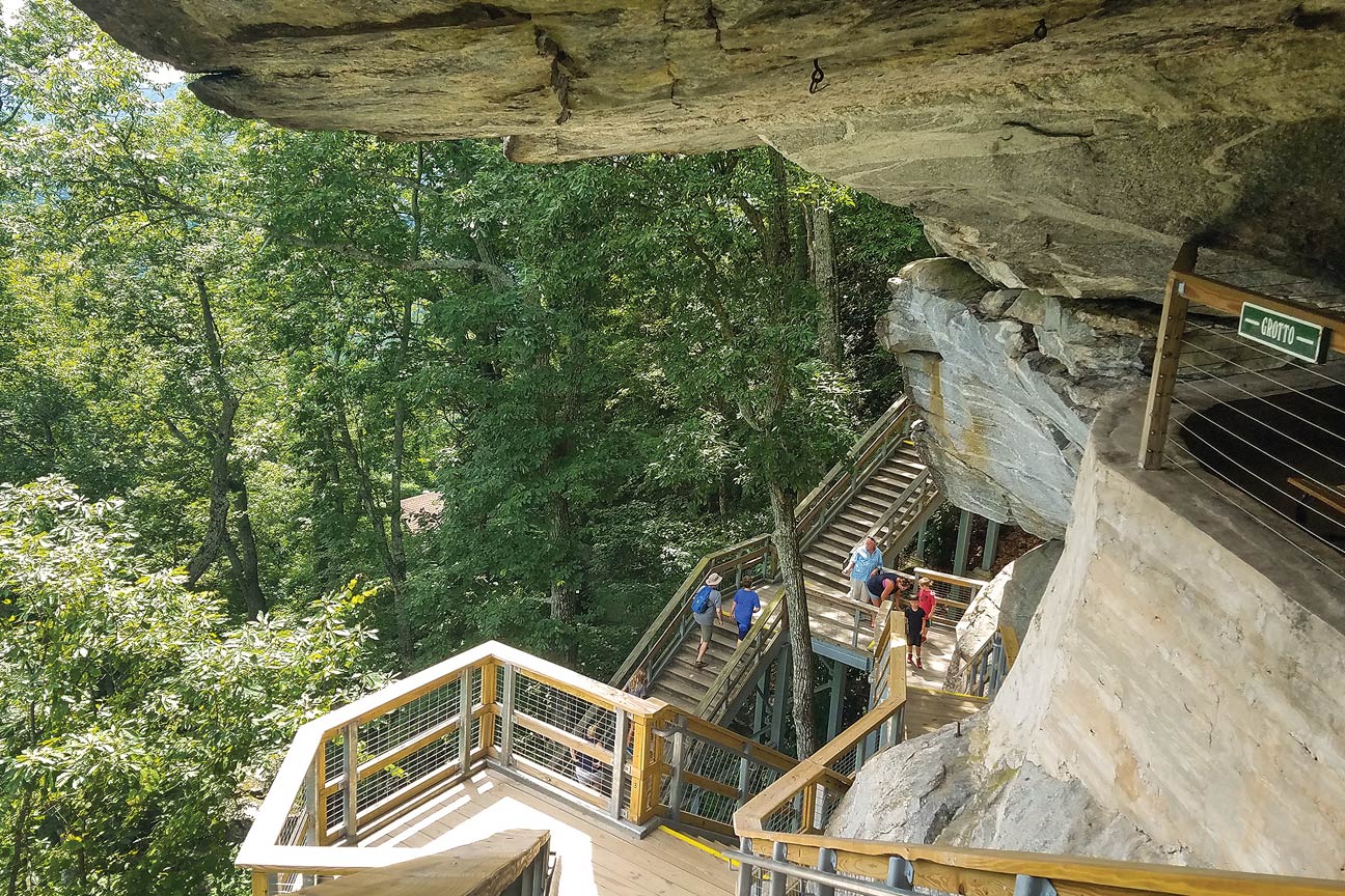 Steps climb alongside a rocky cliff