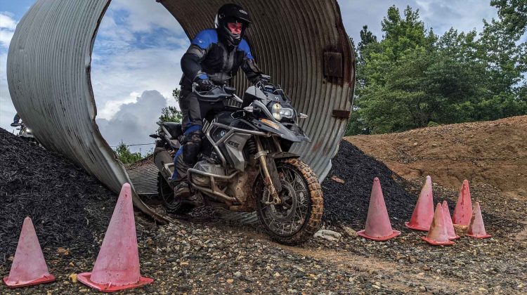 A rider emerges from an obstacle during a lap.