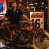 A man stands with a rare Traub motorcycle.