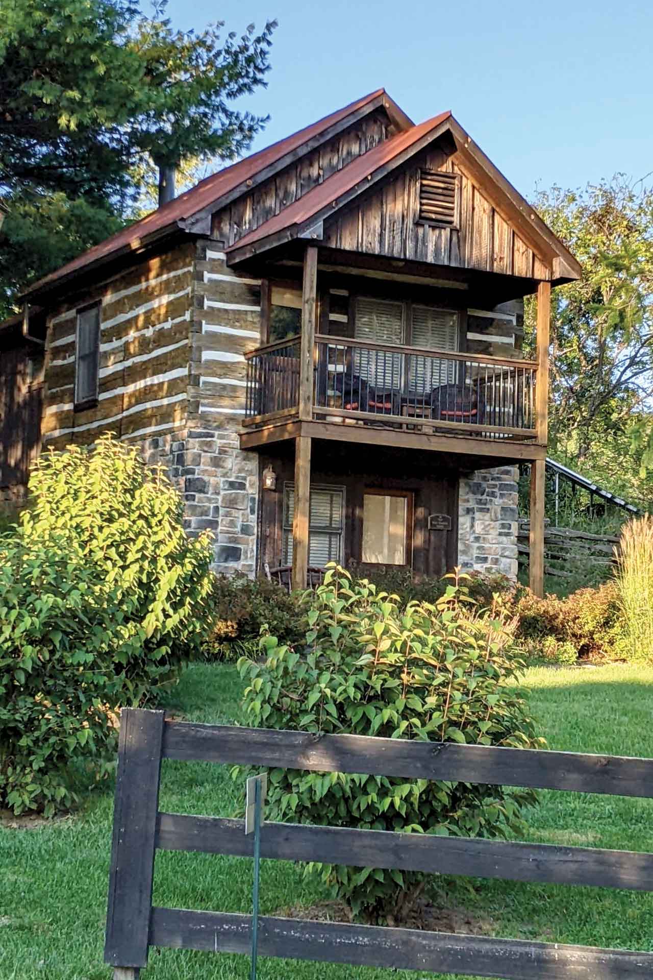 A rustic two story log cabin