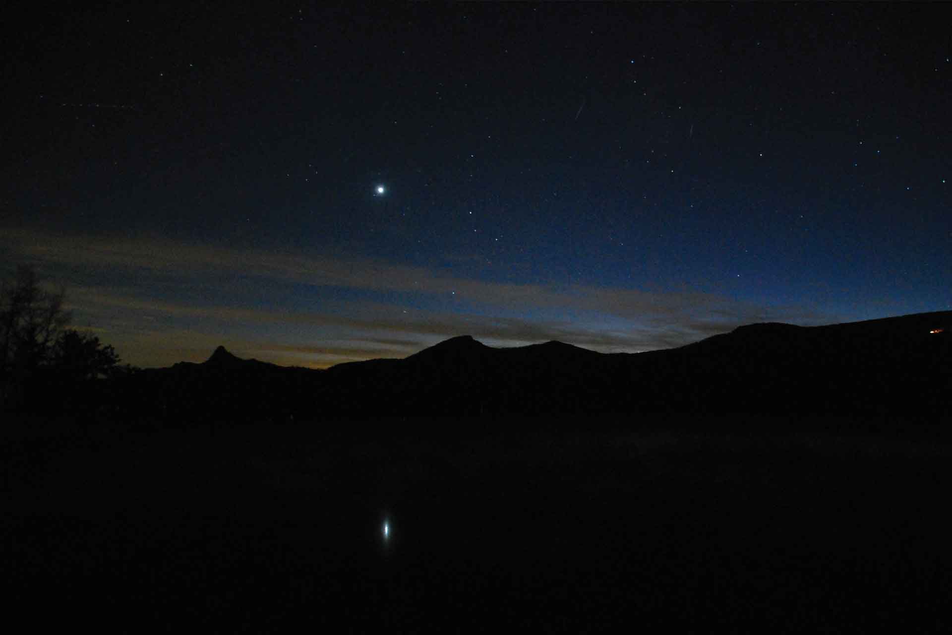 A nighttime view shows mysterious lights hovering near Brown Mountain