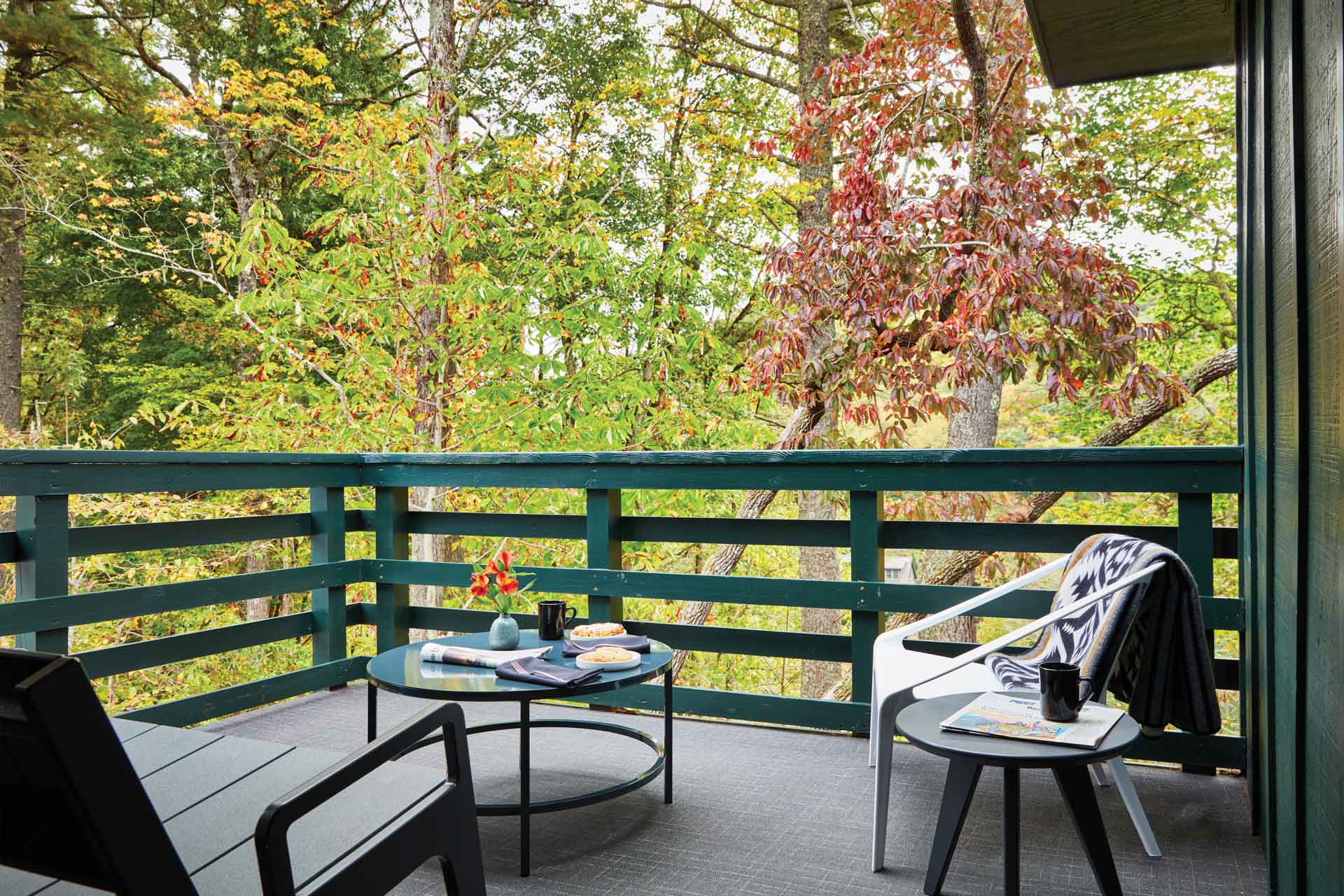 A private deck is set for breakfast at the Skyline Lodge